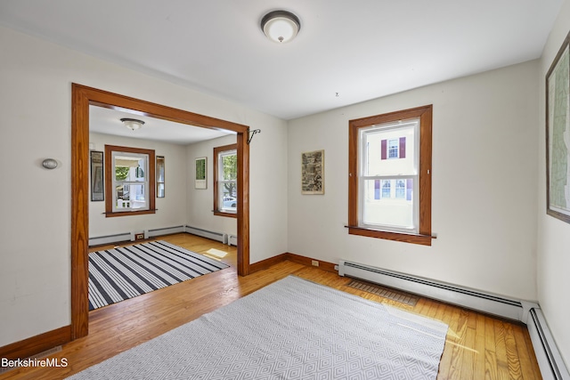 41 Pine St, Dalton, MA 01226 - empty room with a baseboard radiator, wood finished floors, and baseboards