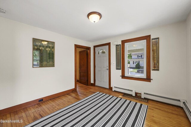 41 Pine St, Dalton, MA 01226 - spare room with baseboard heating, light wood-type flooring, and baseboards