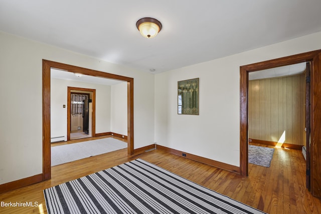 41 Pine St, Dalton, MA 01226 - empty room with baseboards, light wood-type flooring, and baseboard heating