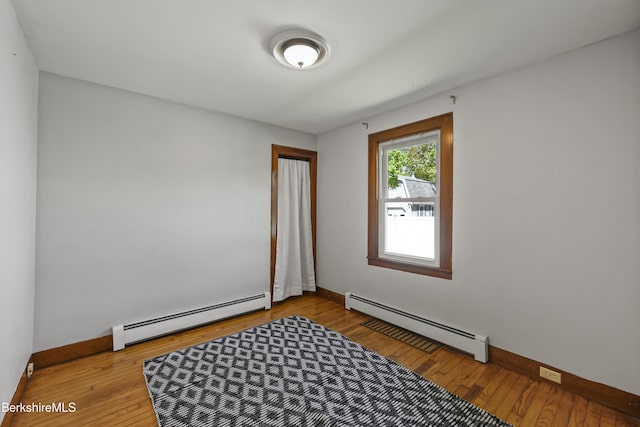 41 Pine St, Dalton, MA 01226 - spare room with a baseboard radiator, baseboards, and wood finished floors