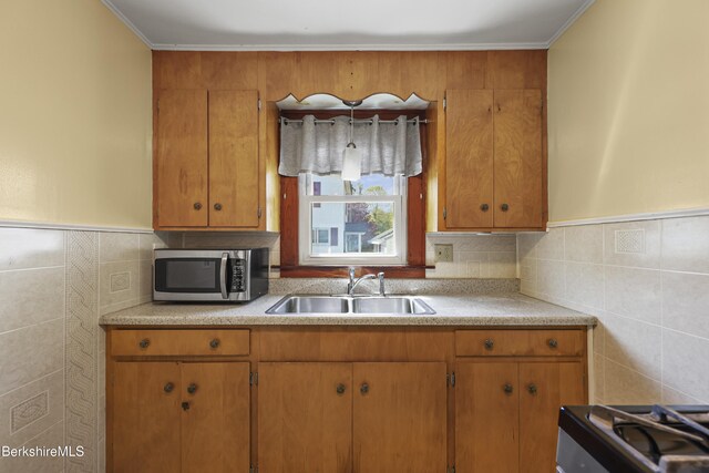 41 Pine St, Dalton, MA 01226 - kitchen featuring a sink, stainless steel microwave, tile walls, light countertops, and gas range oven