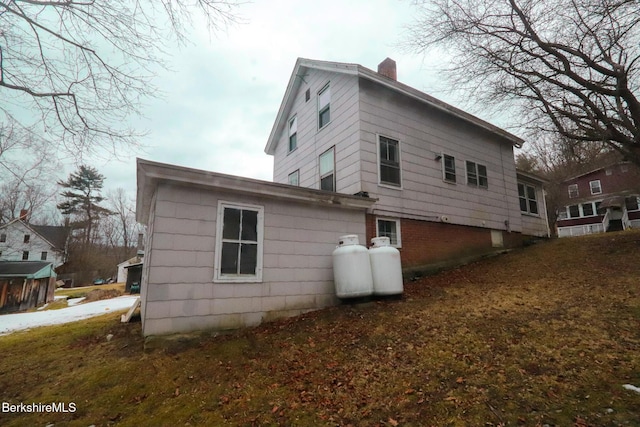 view of side of property featuring a chimney