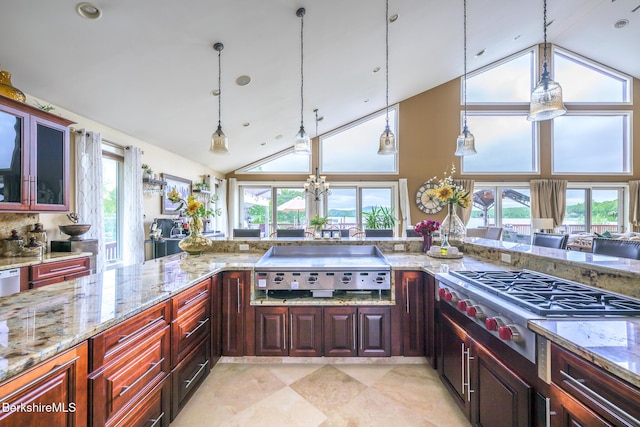 140 Hancock Rd, Pittsfield, MA 01201 - kitchen featuring stainless steel gas stovetop, high vaulted ceiling, healthy amount of natural light, pendant lighting, and light stone counters