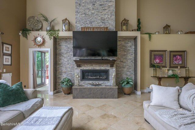 140 Hancock Rd, Pittsfield, MA 01201 - living area featuring a stone fireplace and baseboards
