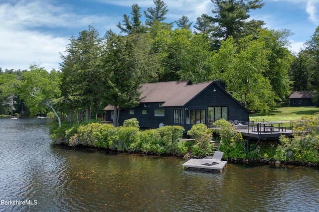 rear view of house with a water view