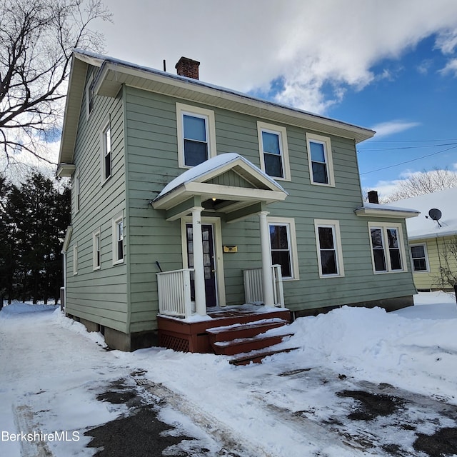 view of front of house with a chimney