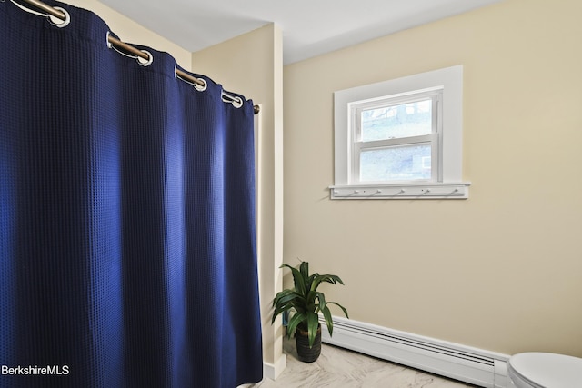 bathroom with a baseboard heating unit, marble finish floor, toilet, and a shower with shower curtain