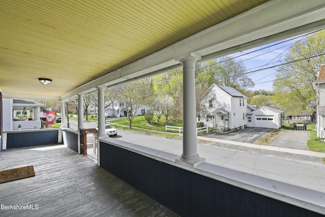 wooden deck with a residential view