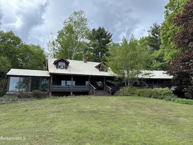 76 Corashire Rd, New Marlborough, MA 01230 - view of front of house with a front lawn, a porch, metal roof, and a chimney