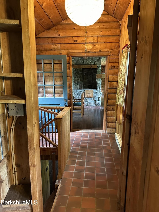 76 Corashire Rd, New Marlborough, MA 01230 - corridor featuring vaulted ceiling, an upstairs landing, wood ceiling, log walls, and dark tile patterned flooring