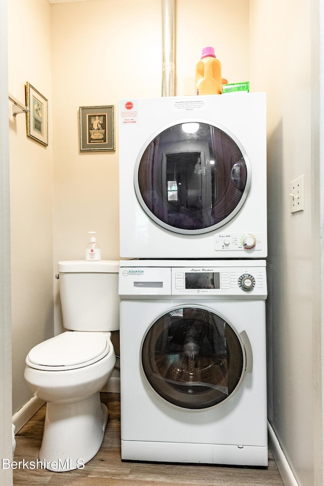 37 Corey Rd Unit 85, Hancock, MA 01237 - washroom featuring stacked washer / dryer and wood finished floors