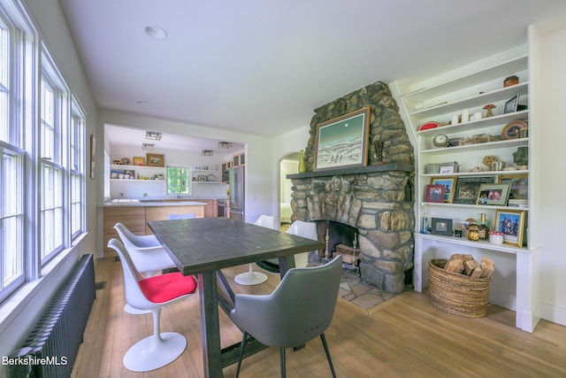 18 Creamery Rd, Egremont, MA 01258 - dining room with radiator heating unit, wood finished floors, and a fireplace