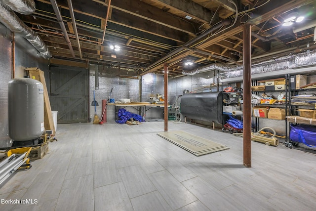 18 Creamery Rd, Egremont, MA 01258 - unfinished below grade area with oil tank, a water pressure tank, and wood finished floors