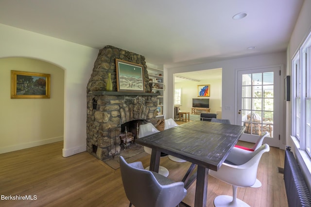 18 Creamery Rd, Egremont, MA 01258 - dining area featuring a fireplace, plenty of natural light, wood finished floors, and built in features