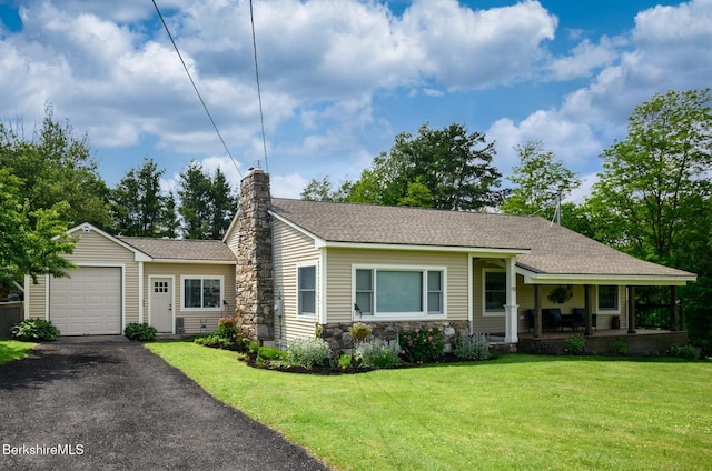 59 Orchard Rd, Dalton, MA 01226 - view of front of house featuring a porch, a garage, asphalt driveway, stone siding, and a front yard
