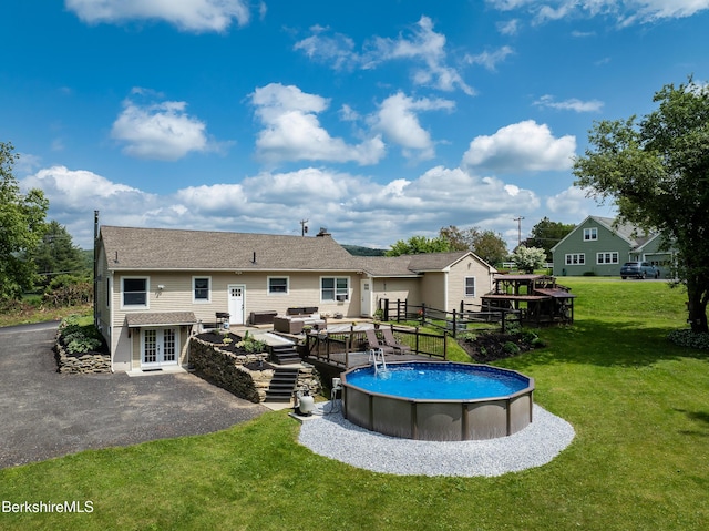 59 Orchard Rd, Dalton, MA 01226 - back of house with french doors, an outdoor living space, a yard, an outdoor pool, and a patio area