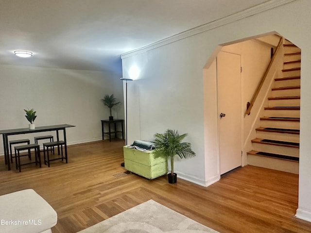 77 King St, Pittsfield, MA 01201 - living area with wood finished floors, arched walkways, stairs, ornamental molding, and baseboards