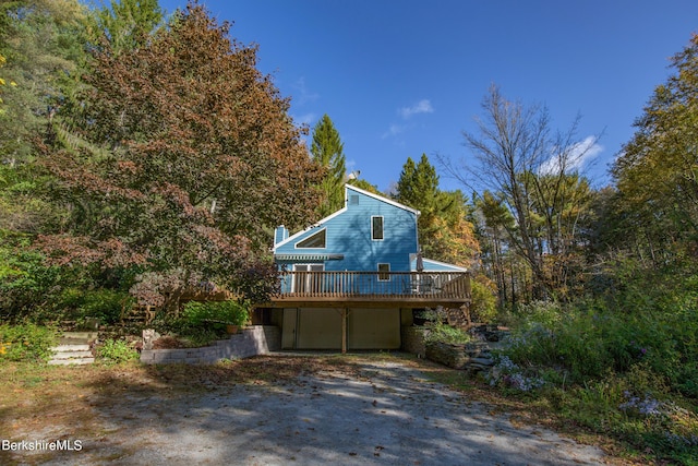 view of side of property with a deck