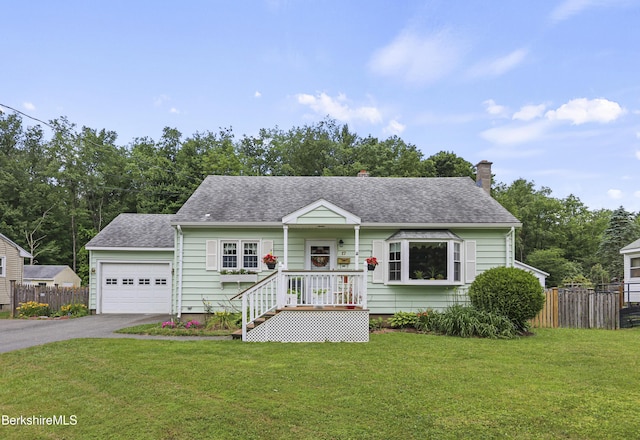 17 Jeffrey Dr, Pittsfield, MA 01201 - view of front facade with asphalt driveway, a garage, a shingled roof, and a chimney
