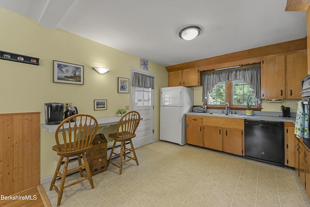 17 Jeffrey Dr, Pittsfield, MA 01201 - kitchen with freestanding refrigerator, dishwasher, light countertops, light flooring, and brown cabinets