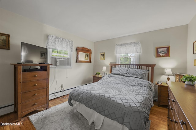 17 Jeffrey Dr, Pittsfield, MA 01201 - bedroom featuring multiple windows, light wood-style floors, a baseboard heating unit, and cooling unit