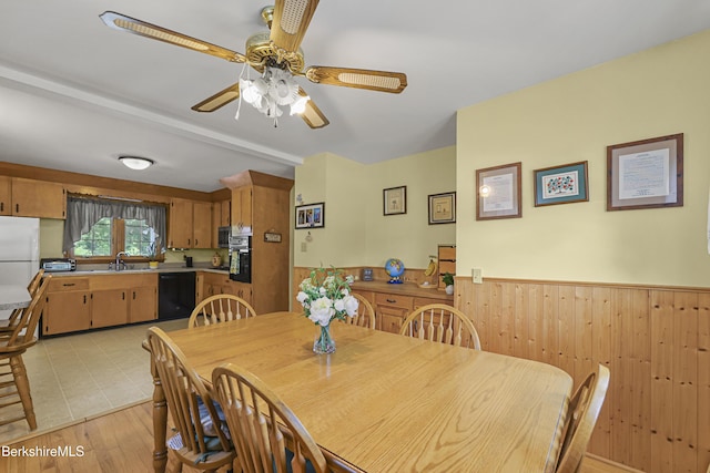 17 Jeffrey Dr, Pittsfield, MA 01201 - dining space featuring a wainscoted wall, a ceiling fan, wooden walls, and light wood-type flooring