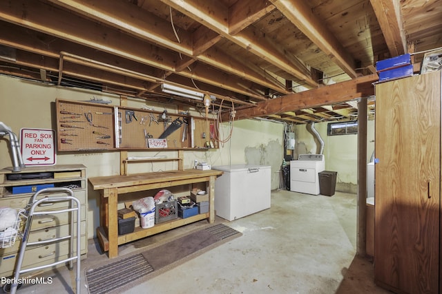 17 Jeffrey Dr, Pittsfield, MA 01201 - unfinished basement featuring refrigerator, separate washer and dryer, and a workshop area