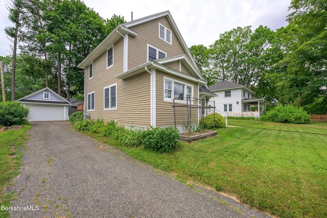 16 Revere Pkwy, Pittsfield, MA 01201 - view of home's exterior featuring an outdoor structure, a yard, and a detached garage