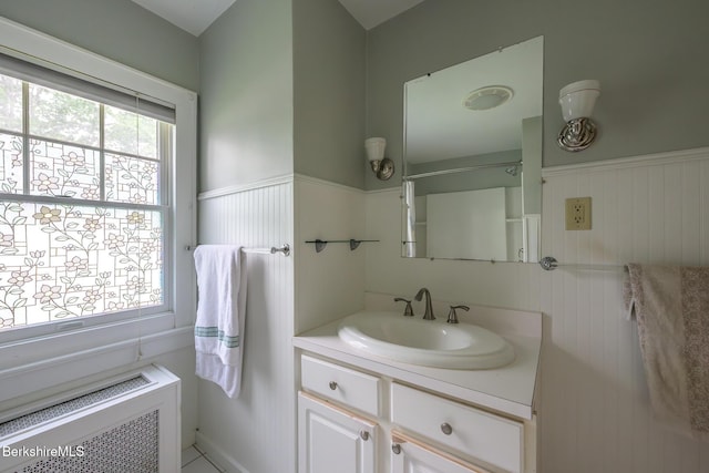 16 Revere Pkwy, Pittsfield, MA 01201 - bathroom featuring radiator, vanity, and wainscoting