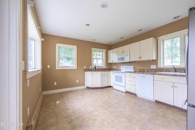 16 Revere Pkwy, Pittsfield, MA 01201 - kitchen with white appliances, white cabinets, light stone counters, recessed lighting, and light tile patterned flooring