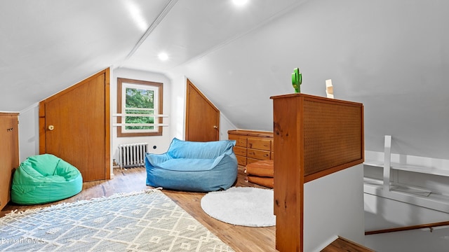 76 New Lenox Rd, Lenox, MA 01240 - sitting room featuring radiator heating unit, vaulted ceiling, and wood finished floors