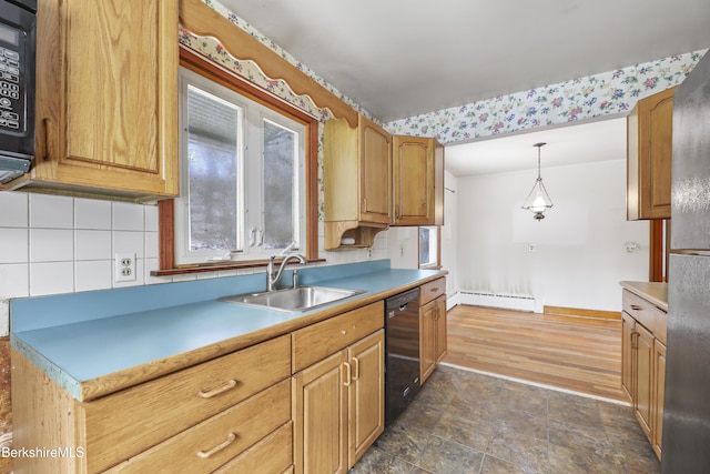 kitchen featuring black appliances, sink, hanging light fixtures, and a baseboard radiator