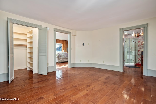 41 Bulkley St, Williamstown, MA 01267 - full bath with wallpapered walls, wood finished floors, a shower stall, and a baseboard radiator