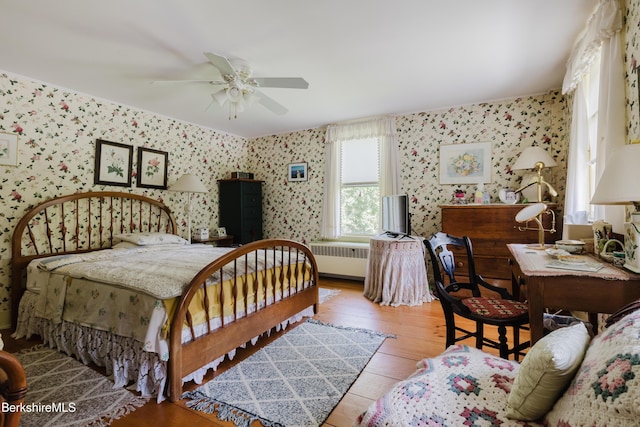 70 Main St, Egremont, MA 01258 - bedroom with wallpapered walls, radiator heating unit, light wood-type flooring, and a ceiling fan