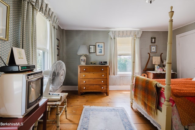70 Main St, Egremont, MA 01258 - bedroom with wallpapered walls, light wood-type flooring, and ornamental molding