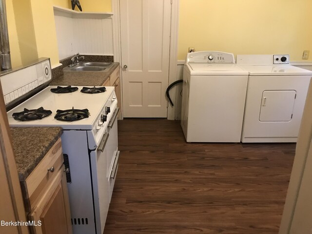 kitchen with dark hardwood / wood-style flooring and gas range gas stove