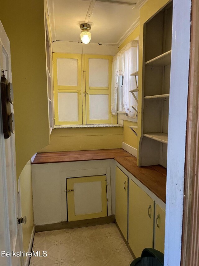 unfurnished room featuring crown molding, radiator, and hardwood / wood-style flooring