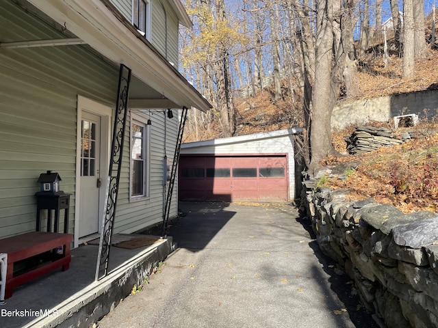 exterior space with an outdoor structure and a garage