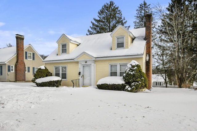 cape cod house with a chimney