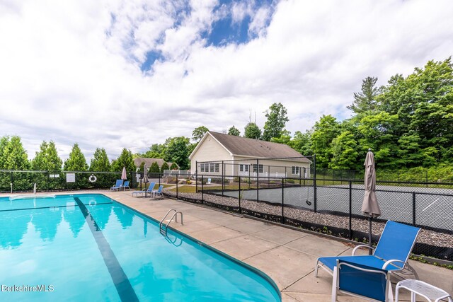 19 Aspen Way, Pittsfield, MA 01201 - community pool featuring a patio and view of wooded area