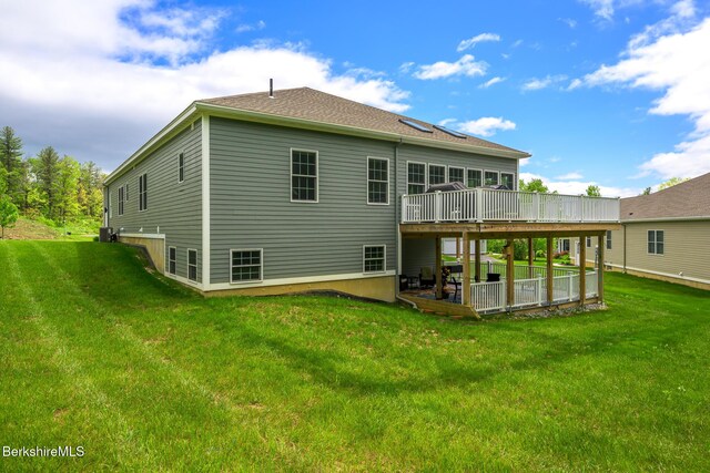 19 Aspen Way, Pittsfield, MA 01201 - back of house featuring a wooden deck, a lawn, a patio, and a shingled roof