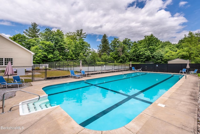19 Aspen Way, Pittsfield, MA 01201 - community pool featuring a patio and view of wooded area