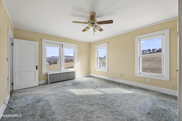 860 Stratton Rd, Williamstown, MA 01267 - empty room with radiator heating unit, ornamental molding, ceiling fan, baseboards, and carpet flooring