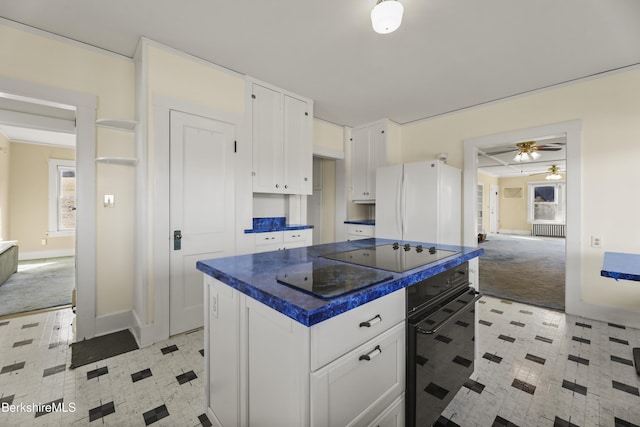 860 Stratton Rd, Williamstown, MA 01267 - kitchen featuring black appliances, white cabinets, dark countertops, light flooring, and a ceiling fan