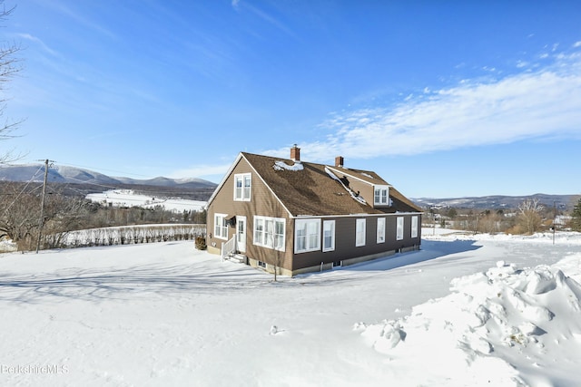 860 Stratton Rd, Williamstown, MA 01267 - view of snowy exterior featuring a chimney and a mountain view