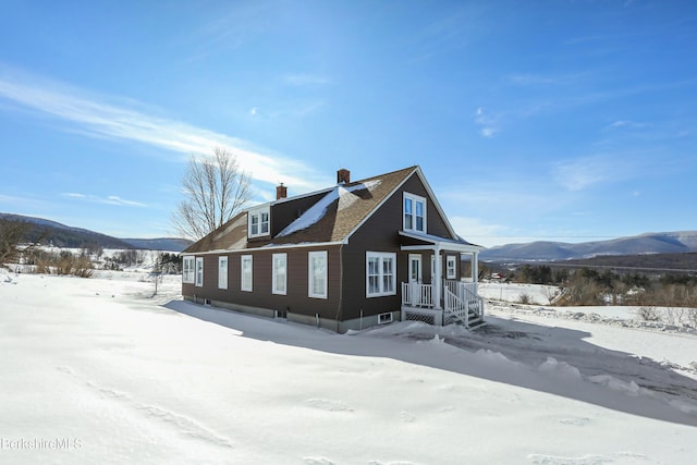 860 Stratton Rd, Williamstown, MA 01267 - view of snow covered exterior with a mountain view and a chimney