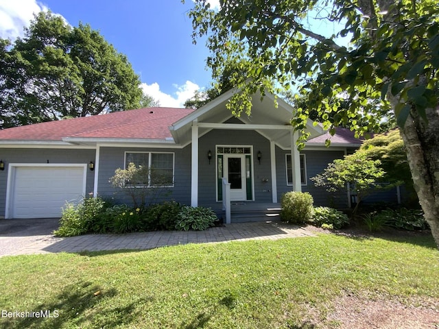 11 Prospect Hill Rd Unit 1, Stockbridge, MA 01262 - ranch-style house featuring a garage, covered porch, a front yard, roof with shingles, and asphalt driveway