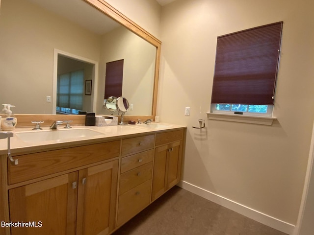 11 Prospect Hill Rd Unit 1, Stockbridge, MA 01262 - bathroom featuring double vanity and baseboards