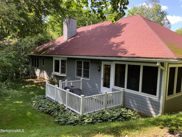 11 Prospect Hill Rd Unit 1, Stockbridge, MA 01262 - back of house with a chimney, a deck, a shingled roof, and a yard