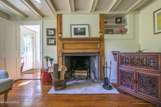 85 E Main St, Stockbridge, MA 01262 - living room with beamed ceiling, hardwood / wood-style flooring, and a large fireplace